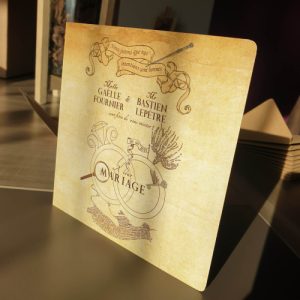 Couverture du faire part de mariage Harry Potter avec 2 alliances entrelacées